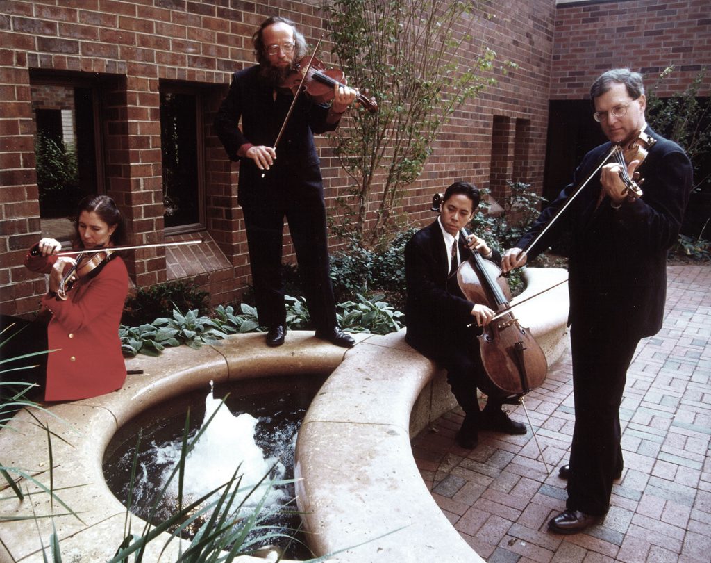 [Wilma Ward Courtyard (L-R: Cornelia Heard, violin; Stephen Kochanowski, viola; Felix Wang, cello; Chris Teal, violin)]