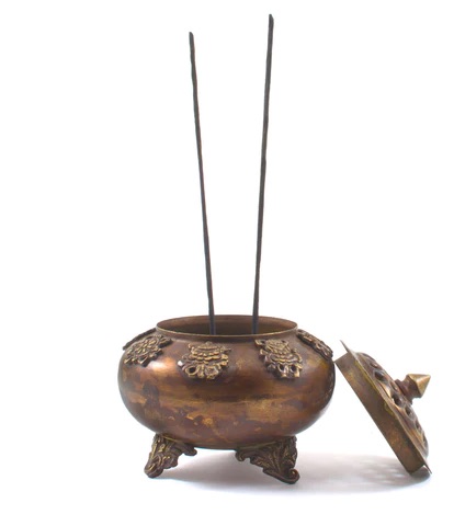 An example of Tibetan Incense Burner being used to burn incense