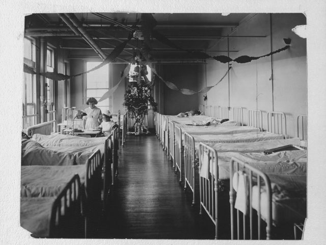 Nursing students and patients inside the 5th and Elm hospital, apparently near Christmas,